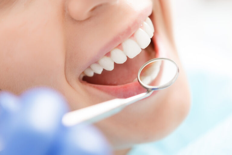 Close up of woman having her teeth examined
